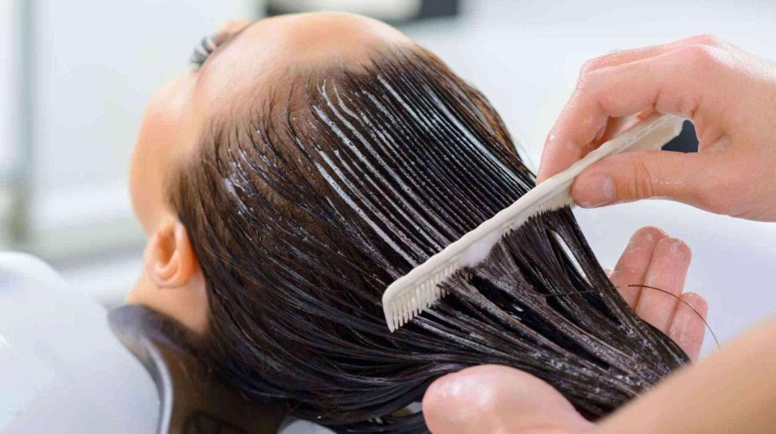 Women Treating her Hair with Deep Conditioning