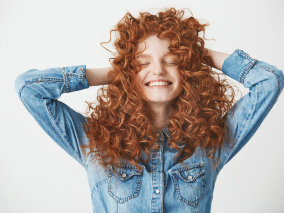 Woman showcasing her beautiful curly hair.