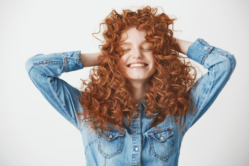 Woman showcasing her beautiful curly hair.