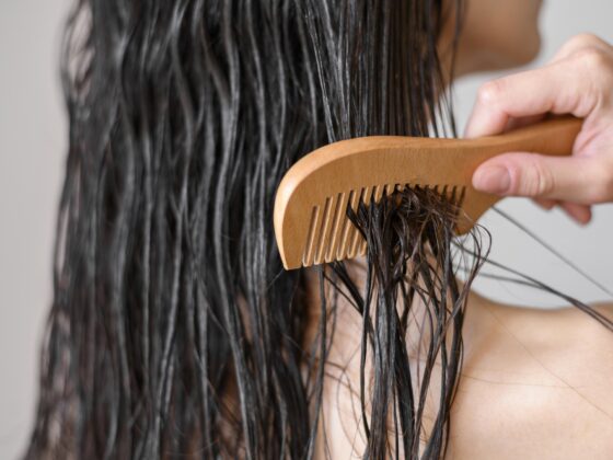 Woman showcasing her luscious, coarse hair.