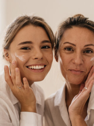 Women smiling with healthy skin as a result of age appropriate skincare.