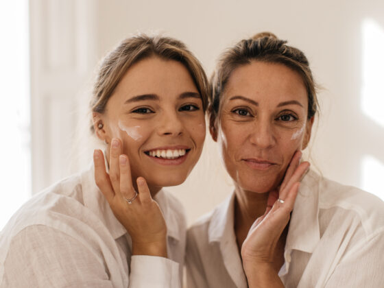 Women smiling with healthy skin as a result of age appropriate skincare.