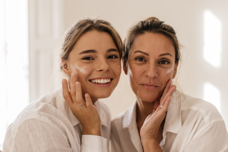 Women smiling with healthy skin as a result of age appropriate skincare.