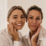 Women smiling with healthy skin as a result of age appropriate skincare.