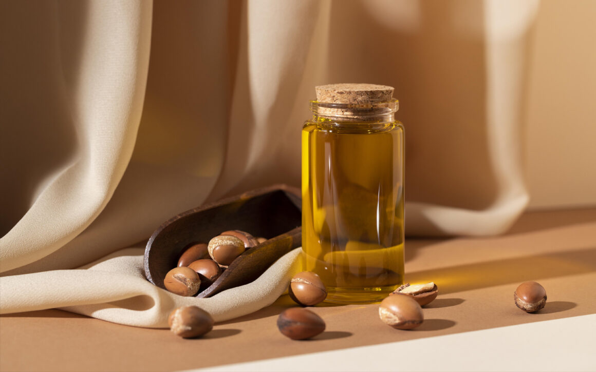 argan oil bottle with argan seeds in the scene